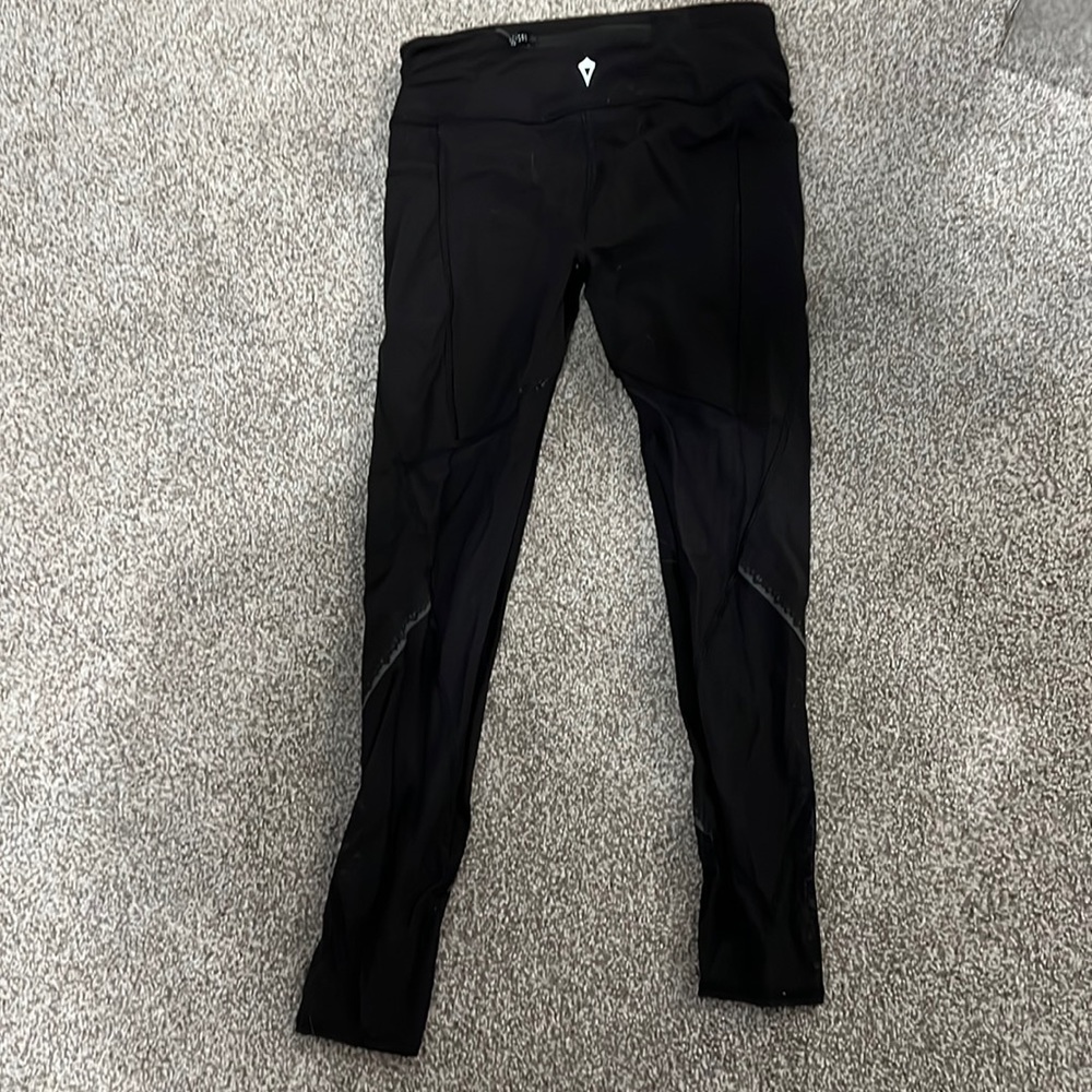 Ivivva black leggings with mesh at the bottoms, size 10 girls.